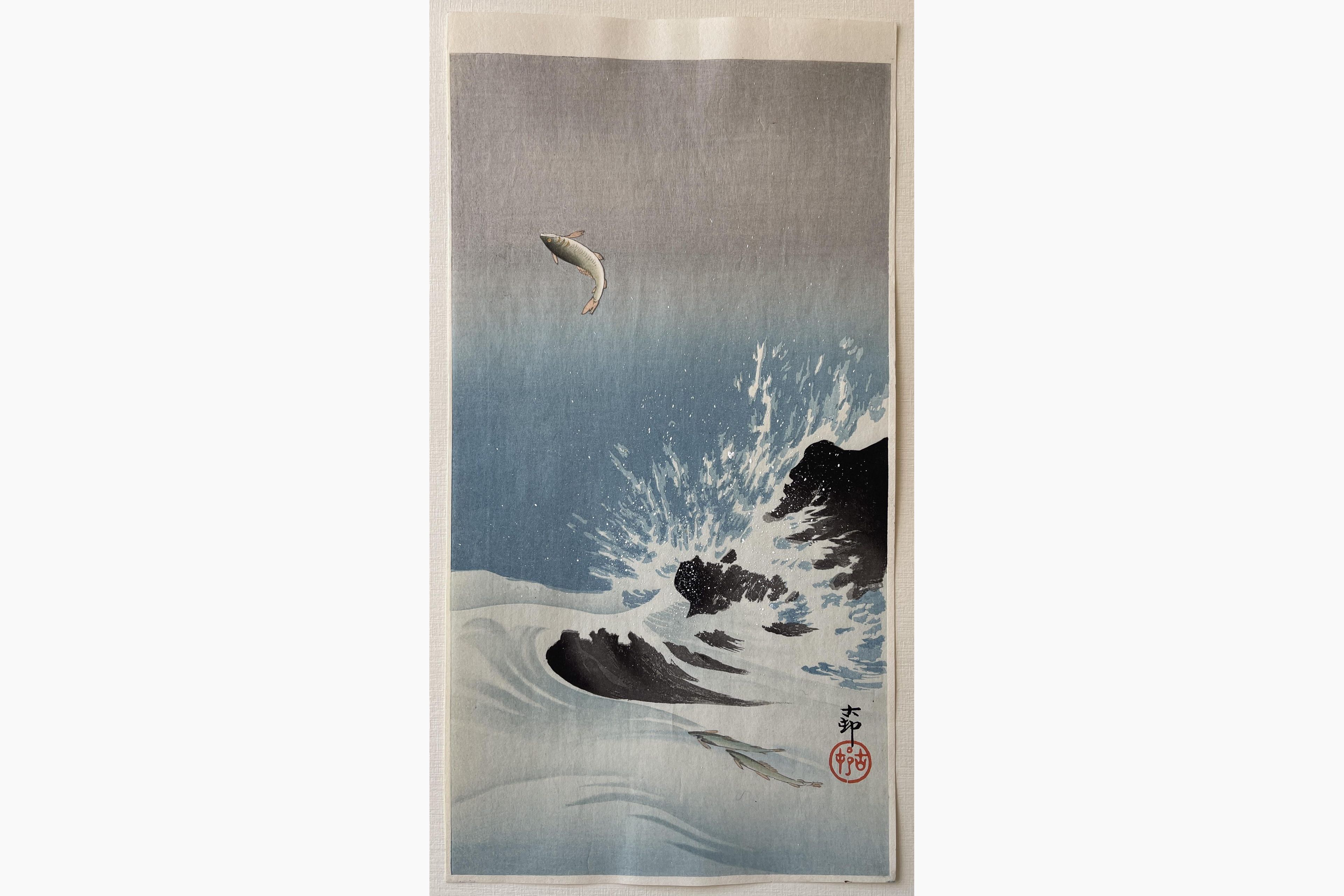 Japanese woodblock print - Ohara Koson - Three Salmon, one jumping high above water splashing around rocks